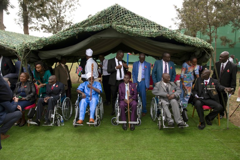 Kenyan World War II veterans and family members wait to meet King Charles III at Kariokor World War II Commonwealth Cemetery