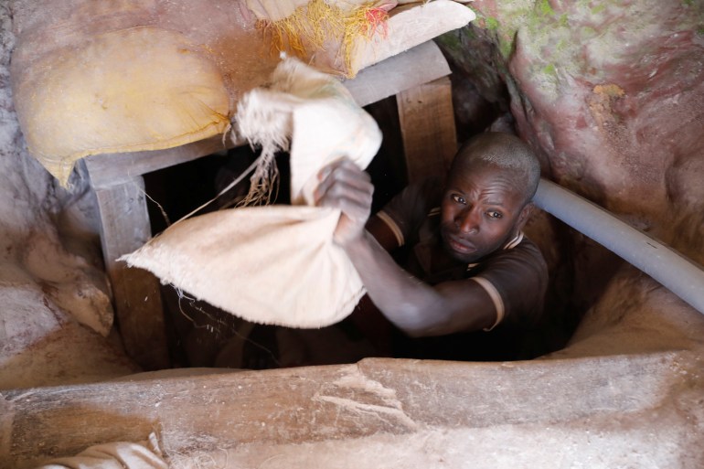 A miner works at the entrance of a shaft at the SMB coltan mine near the town of Rubaya in the Eastern Democratic Republic of Congo