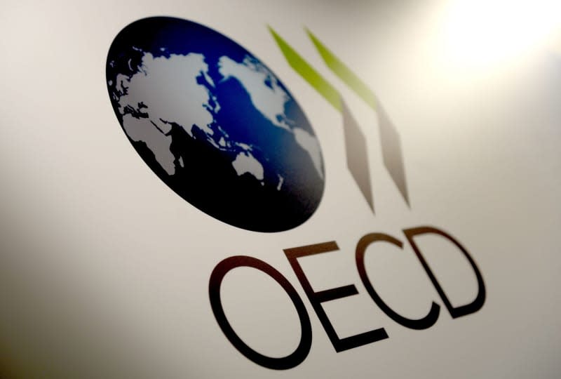 The logo of the Organization for Economic Co-operation and Development (OECD) is pictured in Berlin. OECD has yet again revised its forecast for economic growth in Germany downwards and now sees only miniscule growth of 0.2% for this year. Britta Pedersen/dpa-Zentralbild/dpa