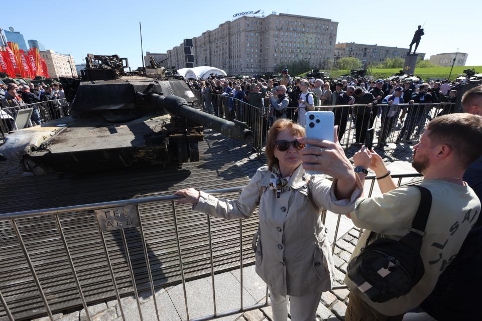 Visitors look at a M1A1 Abrams main battle tank, made in the USA, and captured in Ukraine, at the Trophies of Russian Army exhibition, while celebrating the International Worker's Day, at the Poklonnaya Hill, May 1, 2024, in Moscow, Russia.
