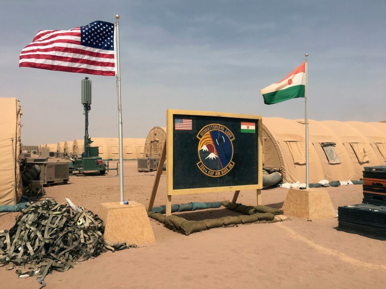 A US and Niger flag are raised side by side at the base camp for air forces and other personnel supporting the construction of Niger Air Base 201 in Agadez
